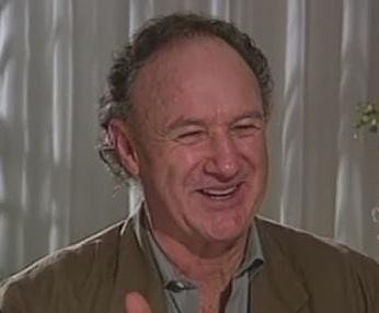 Gene Hackman w intensywnej scenie filmowej, ukazujący swoją charyzmę aktorską.